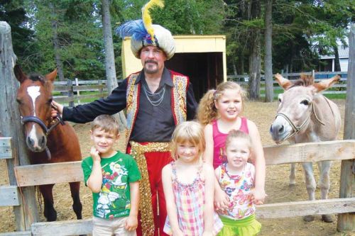 Zanzar the Magical Genie with young animal lovers at the Land O' Lakes Petting Farm's Family Day fundraiser on August 10  